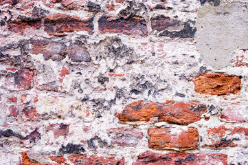 Old decayed stone brick wall background