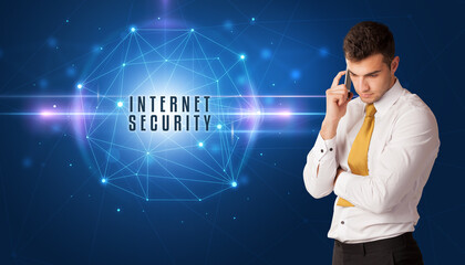 Businessman thinking about security solutions with INTERNET SECURITY inscription