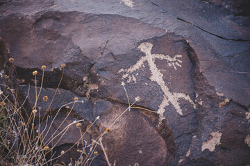 Stone drawings called petroglyphs carved on desert rocks by native indigenous people near Las Vegas, Nevada