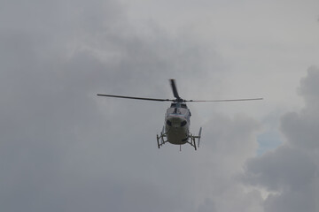Humanitarian food distribution, World Food Program (WFP) helicopter landing at remote place to...