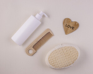 Obraz premium Zero waste bathroom accessories, natural sisal brush, wooden comb and shampoo
