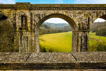 A view across the aqueduct and towards the railway viaduct at Chirk, Wales. The railway viaduct is built above the aqueduct which was to symbolise that railway transport is superior to canal trans