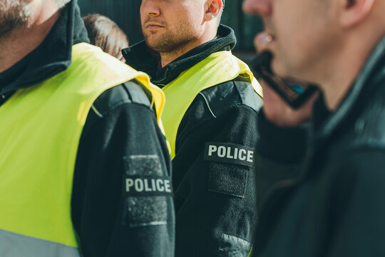 Group Of Police Officers Heading For Intervention On The City Streets