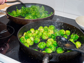 Brussels sprouts and kale fried in a pan