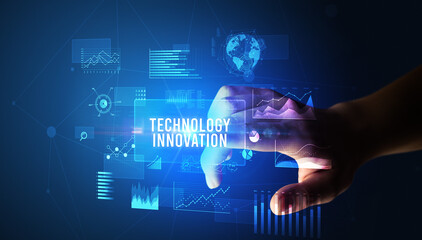 Fototapeta premium Hand touching TECHNOLOGY INNOVATION inscription, new business technology concept