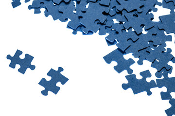 small blue puzzle pieces on a white background, add a picture from small pieces, a useful exercise for the brain, training attention and patience