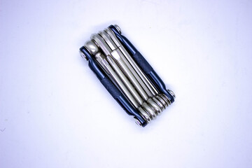 Bicycle multipurpose hex key, Allen set tool isolated on white background. Multi tool for cyclist, bicycle hex set, top view.