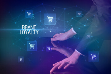 Online shopping with BRAND LOYALTY inscription concept, with shopping cart icons