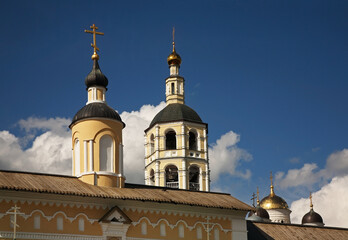 Fototapeta na wymiar Breakthrough gate and bell tower of Monastery of St. Paphnutius - Pafnutyevo-Borovsky monastery in Borovsk. Kaluga oblast. Russia