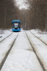 Blue tram in the Sokolniki winter park in Moscow