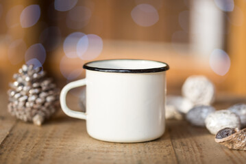 White metal coffee cup, mug on old wooden table