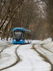 Blue tram in the Sokolniki winter park in Moscow