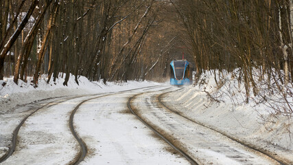 Blue tram in the Sokolniki winter park in Moscow
