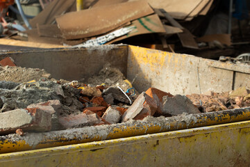 Bricks and rubbish after demolition with rotten and rusty metals.