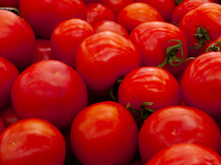 red tomatoes in the supermarket, on the counter