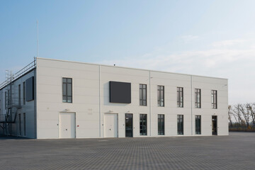 Modern building for car maintenance and repair. Two-storey office building in a closed area