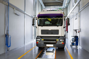 Servicing and repairing trucks in a large garage. Truck in a car service for diagnostics. Car service