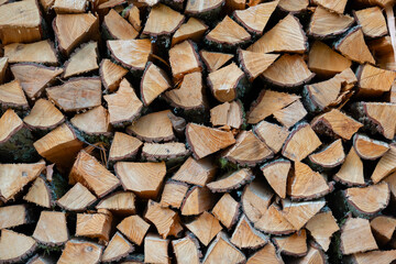 pile stacked natural sawn wooden logs background, top view, timber