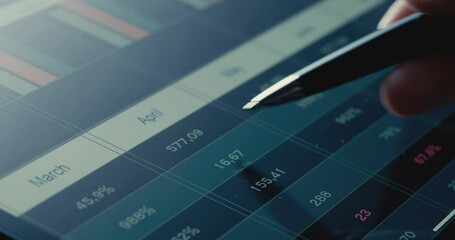 Reviewing business report on digital tablet