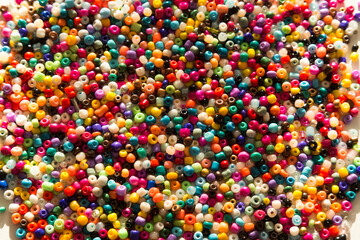 colorful beads and stones on the white background.