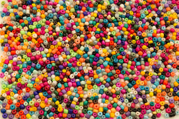 Fototapeta na wymiar colorful beads and stones on the white background.