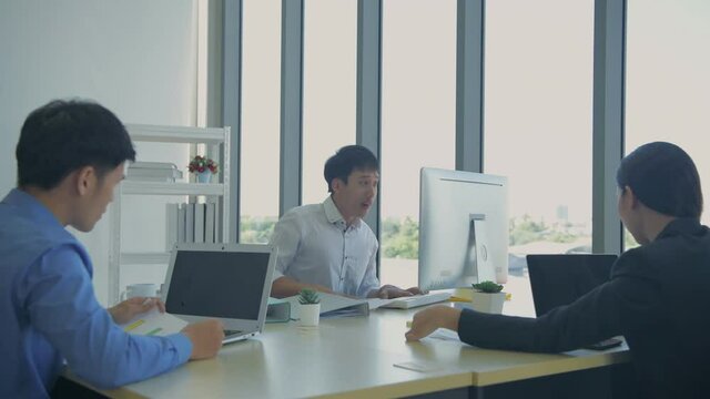 Business concept of 4k Resolution. The team is delighted with the success of the project in the office.