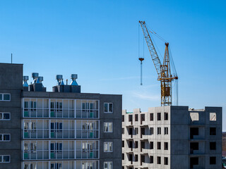 Construction crane for lifting and mounting panels, blocks in the construction of residential buildings, high-rises, skyscrapers