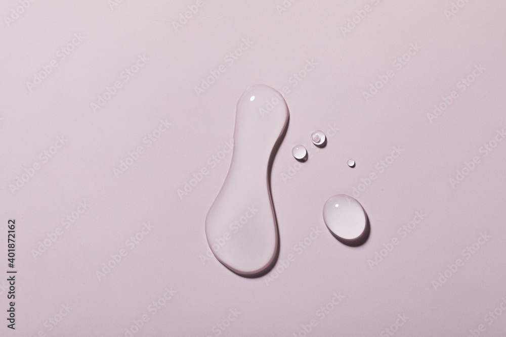 Canvas Prints A top view closeup of multiple water drops on a light purple background