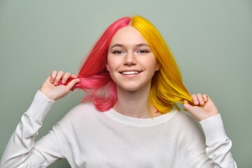 Dyed long hair close-up, girl fashion beauty model showing coloring on her hair