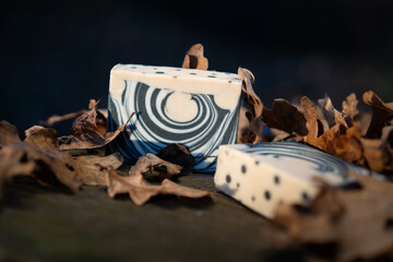Bars of pure natural handmade soap presented in the forest during sunset