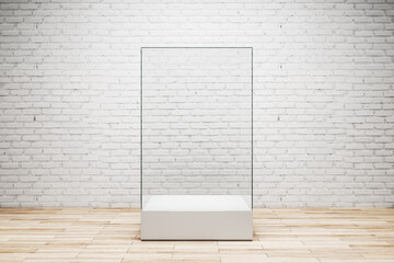 Brick gallery room with empty glass showcase.