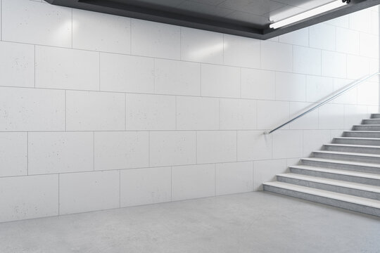 Minimalistic metro station with blank gray walls