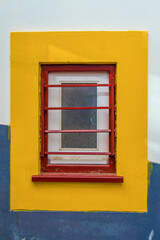 Window on the yellow wall
