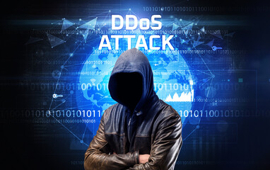 Faceless hacker at work with DDoS ATTACK inscription, Computer security concept