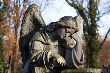 Obraz premium The historic Angel from the winter mystery old Prague Cemetery, Czech Republic