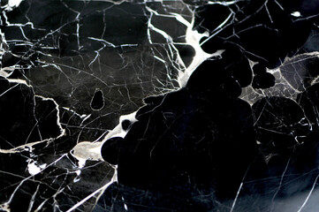 Black marble stone texture for background or luxurious tiles floor and wallpaper decorative design.