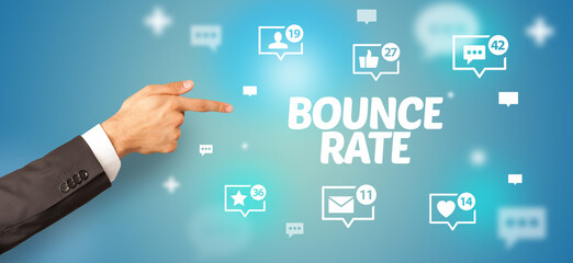 Close-Up of cropped hand pointing at BOUNCE RATE inscription, social networking concept