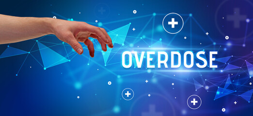 Close-Up of cropped hand pointing at OVERDOSE inscription, medical concept