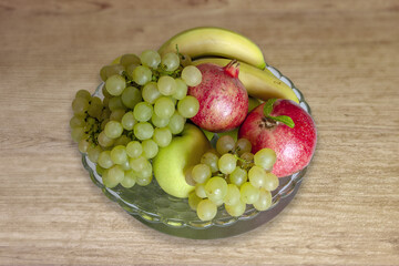 Mixed fruit season, banana, pomegranate, grapes, apple.