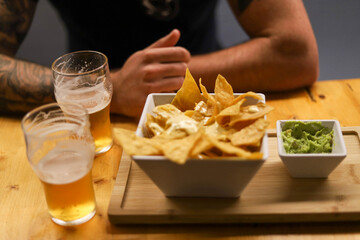 Nachos with guacamole and cheese 