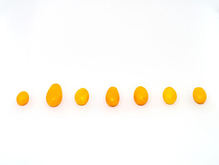 organic kumquat is the smallest fruit of the citrus family, vitamin C. With white background