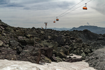Rocky top of the mountains in Tirol Alps with cable car.
