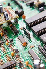 Obraz premium Macro close up of computer green pc motherboard microchip