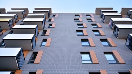 Facade of a modern apartment building with balconies. No people. Real estate business concept.