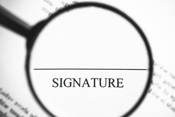 Magnifying glass enlarging signature word on business document. Sign up contract background.