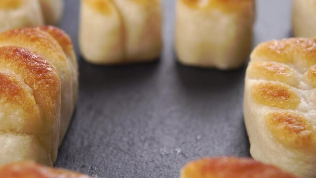 Hand takes Spanish Christmas sweets marzipan. Macro. Dolly Shot