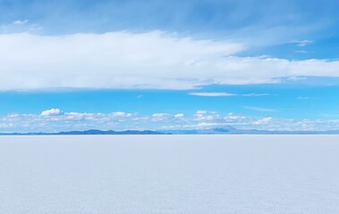 Blue sky and white clouds. Desert white salt flat plain infinity eternity Salar de Uyuni unique vast terrain, white clouds in heaven over white mineral land Altiplano plateau.