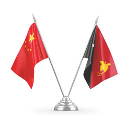 Papua New Guinea and China table flags isolated on white 3D rendering