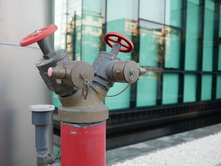 fire department connection in front of a building.
