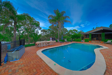 Residential house in Dural a country suburb in Sydney NSW Australia with lush green trees and grass 
